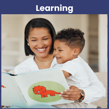 A mom reading a book to her infant son.